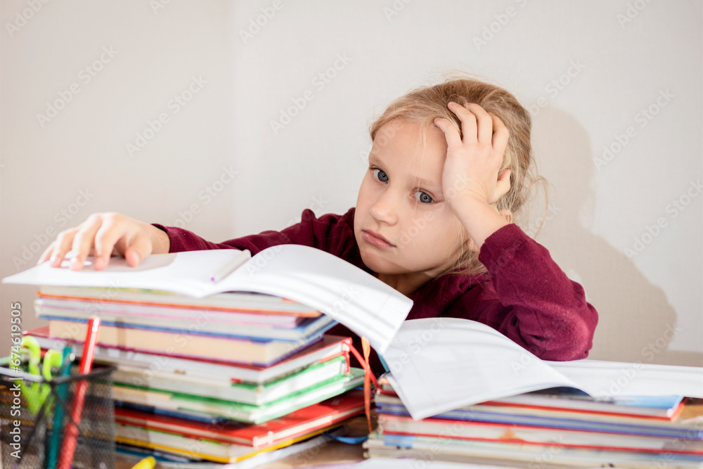 Tired Kid, Stressed Pupil Child doing Homework in Elementary School. Learning Difficulties Disability. Copy Space. Tired Kid, Stressed Pupil Child doing Homework in Elementary School. Learning Difficulties Disability. Copy Space.