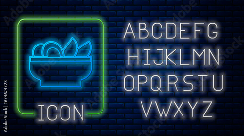 Glowing neon Nachos in plate icon isolated on brick wall background. Tortilla chips or nachos tortillas. Traditional mexican fast food menu. Neon light alphabet. Vector