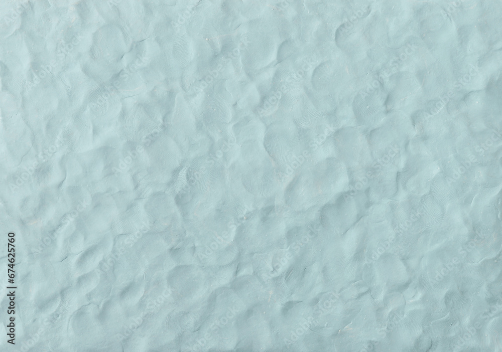 Obraz premium Light blue plasticine texture background. Modeling clay material pattern.