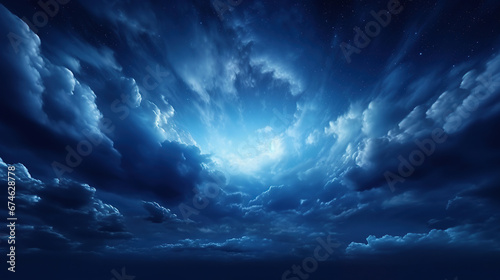 Black dark blue night sky with stars. White cumulus clouds. Moonlight, starlight. Background for design. Astrology, astronomy, science fiction, fantasy, dream. Storm front. Dramatic. photo