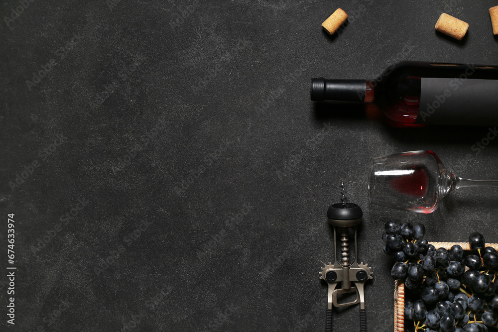 Glass and bottle of exquisite wine with grapes on black background Glass and bottle of exquisite wine with grapes on black background