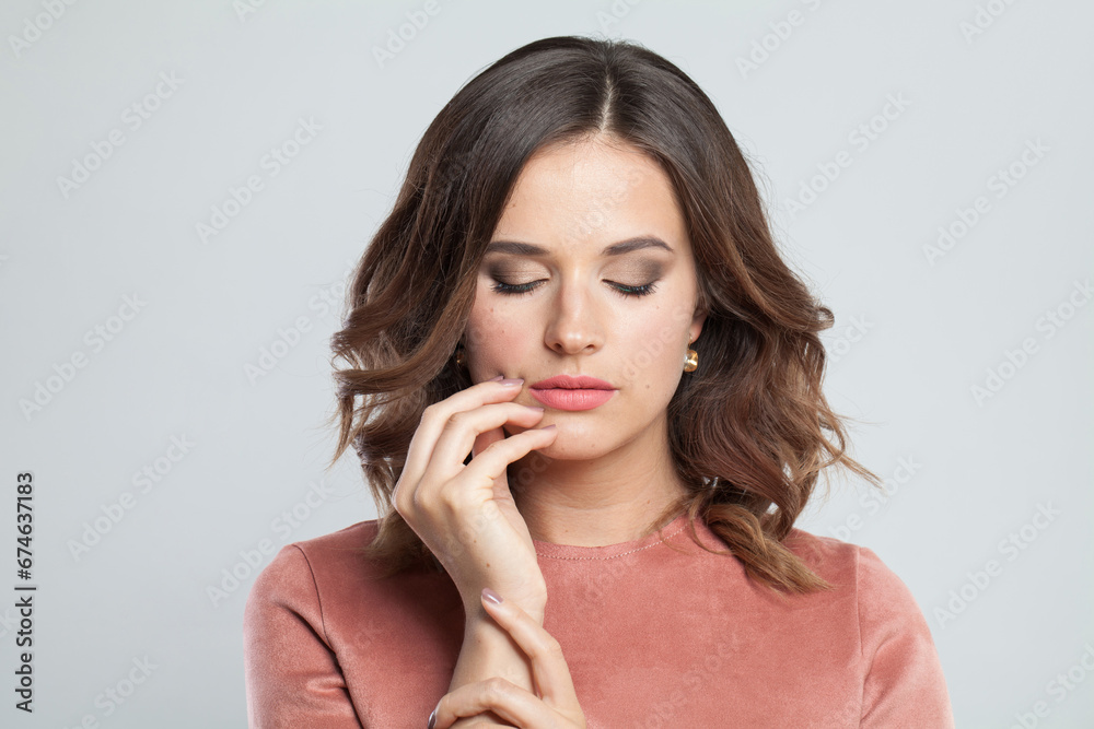 Cute female face closeup. Young brunette woman with makeup and natural healthy skin portrait Cute female face closeup. Young brunette woman with makeup and natural healthy skin portrait