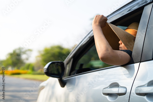 Wallpaper Mural Happy enjoy and freedom in traveling trip with raised hand and holding hat outside of window car in summer vacation holiday. Torontodigital.ca