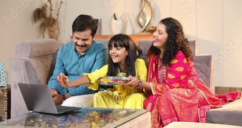 Virtual Raksha Bandhan Celebration sister video calling her brother applying tilak on chat
