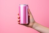 Hand with pink soda can on color background