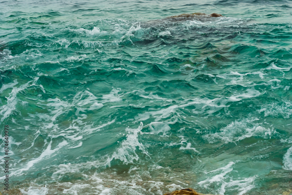 closeup emerald sea waves nar the coast, beautiful natural background