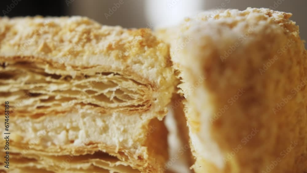 Slice of cake on plate, puff pastry cake with white cream. Slice of cake on plate, puff pastry cake with white cream.