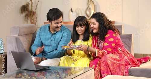 Virtual Raksha Bandhan Celebration sister video calling her brother doing aarati 
