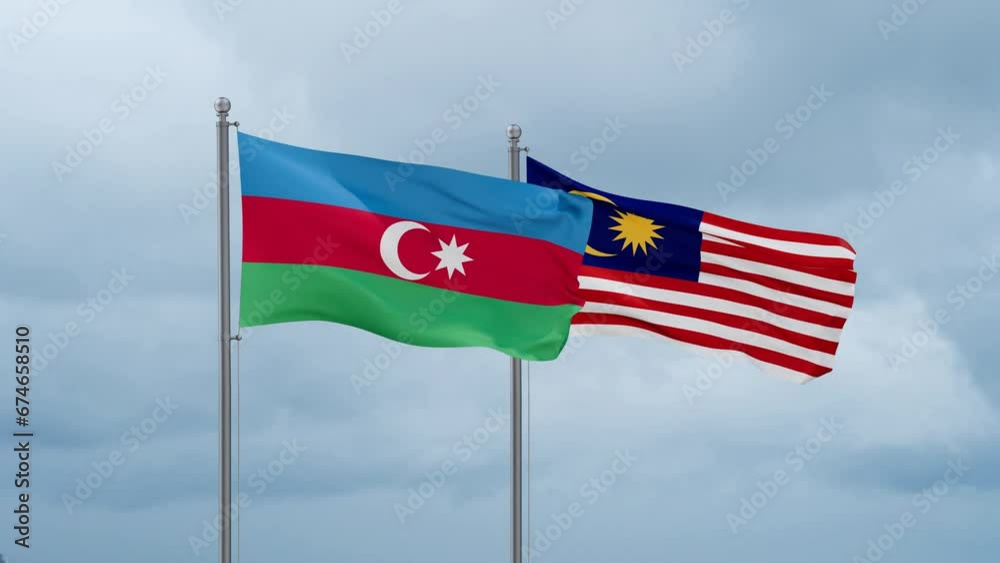 Malaysia and Azerbaijan flag waving together on cloudy sky, endless seamless loop, two country cooperation concept Malaysia and Azerbaijan flag waving together on cloudy sky, endless seamless loop, two country cooperation concept