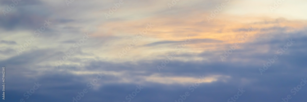 Beautiful morning sky background with clouds. Scenic dawn cloudscape. Wide panoramic background for design.