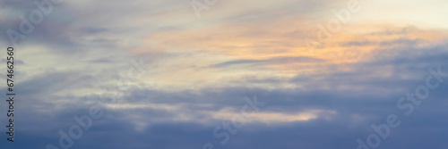 Beautiful morning sky background with clouds. Scenic dawn cloudscape. Wide panoramic background for design.