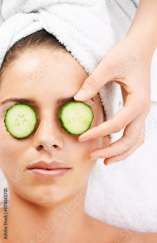 Woman, hand and cucumber on eyes for wellness, cosmetic or spa therapy with closeup, relax and peace. Person, skincare or detox treatment for beauty, skin or stress relief and relaxation or wellbeing