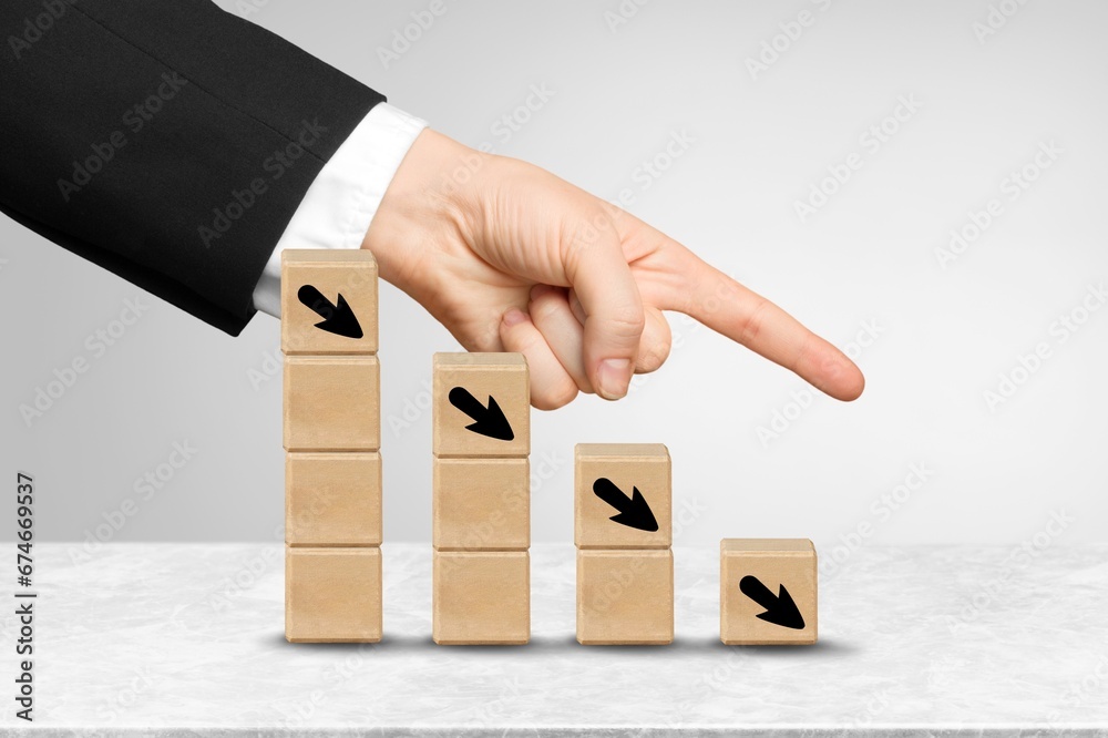 Wooden blocks with arrows icons on the desk