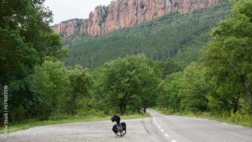 A bicycle next to a road in the Esterel mountains in and around the Gorges du Blavet and Bagnols-en-Forêt in the region Provence-Alpes-Côte d’Azur in France, in the month of June