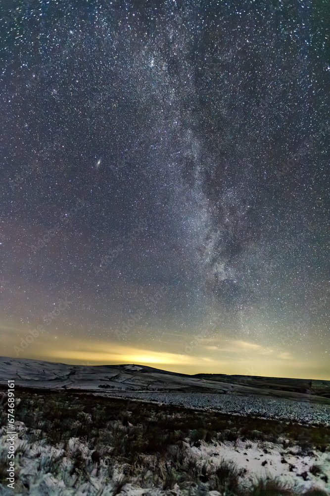 milky way over snowy fields