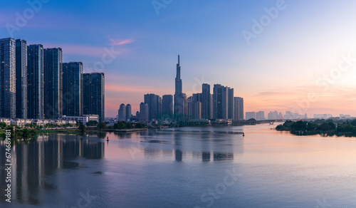 Landmark 81 and other modern buildings are brilliant at the dawn in Ho Chi Minh city. photo