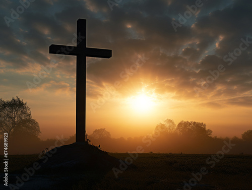 Silhouette of catholic cross and sunrise in a cemitery poetical image photo