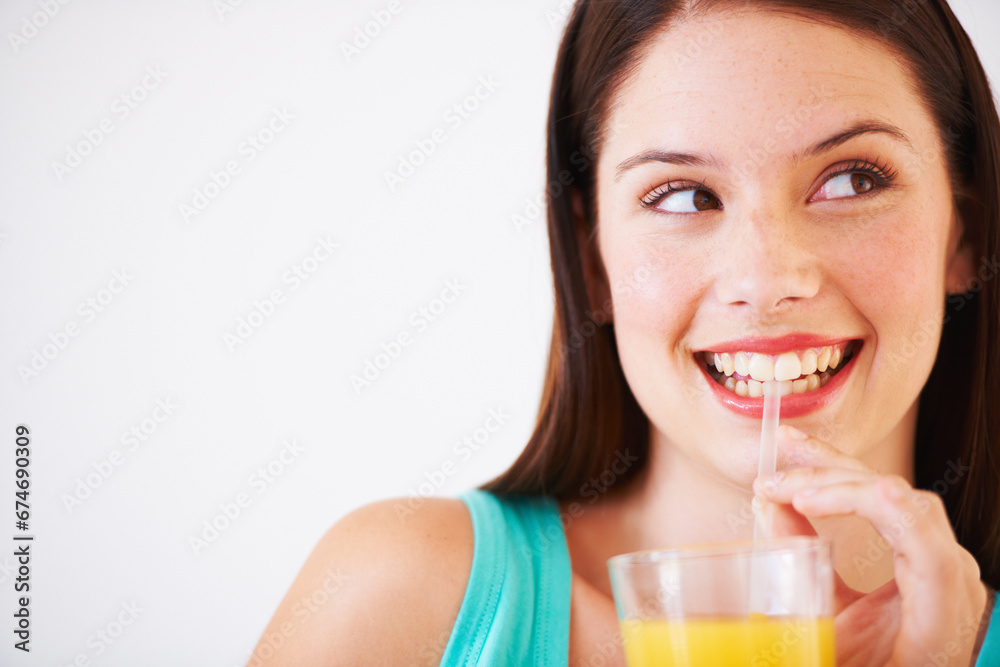 Happy, drinking and face of woman with juice for nutrition, wellness and hydration in studio. Beverage, smile and thirsty person with fruit blend for vitamins, detox and diet on white background Happy, drinking and face of woman with juice for nutrition, wellness and hydration in studio. Beverage, smile and thirsty person with fruit blend for vitamins, detox and diet on white background