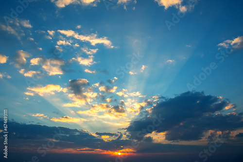 brightly colorful clouds in the evening sky. Lush colored clouds in the sky before sunset