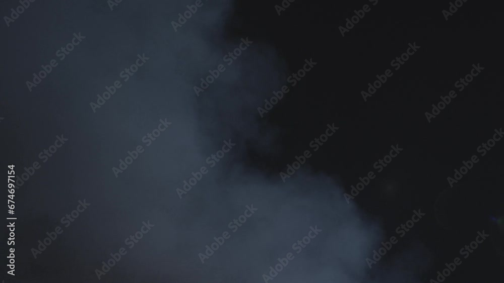 Smoke on dark background. Realistic atmospheric gray fog haze cloud. High quality 4k footage Smoke on dark background. Realistic atmospheric gray fog haze cloud. High quality 4k footage