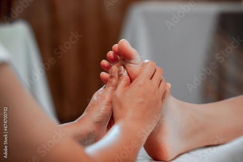foot massage in spa  soft focus image