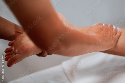 foot massage in spa  soft focus image © aroon