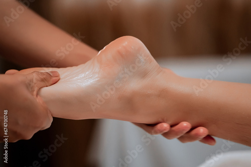 foot massage in spa  soft focus image