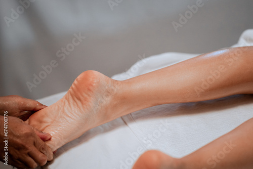 foot massage in spa  soft focus image