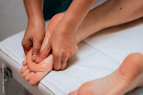 foot massage in spa soft focus image