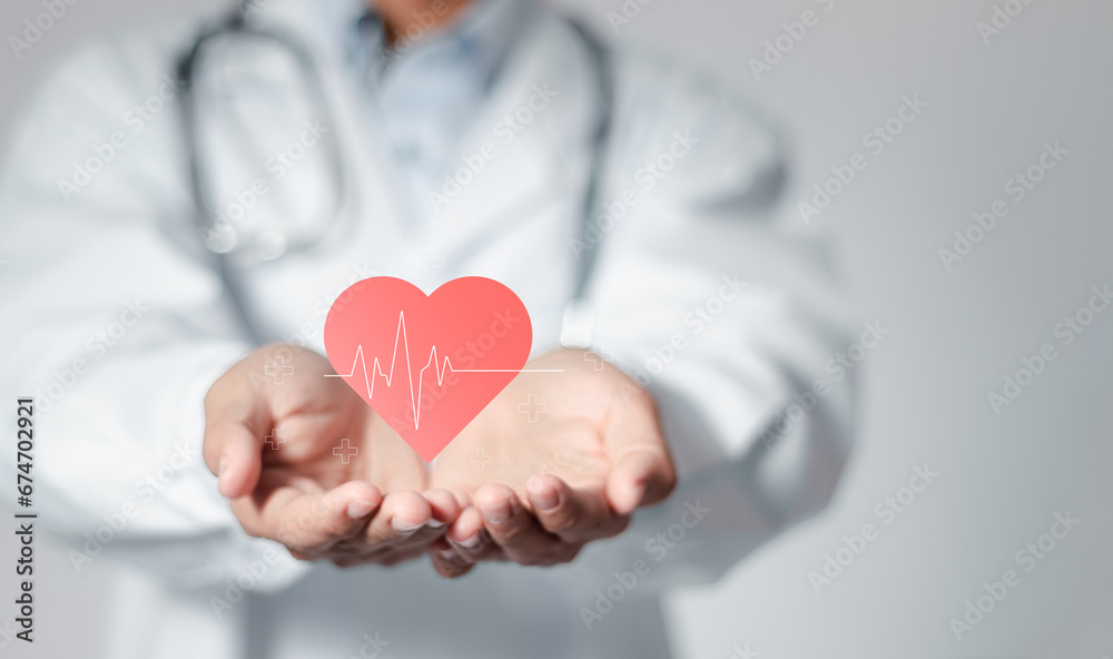 Cardiologist doctor holding heartbeat icon for checking the function of the patient heart. medical check up, heart attack, cardiology, help from specialist.