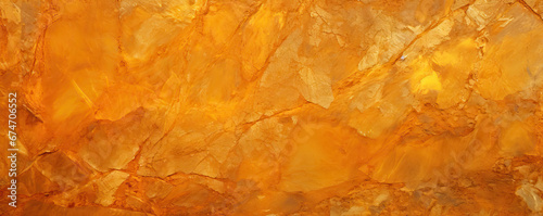 a background orange colored stone and gold with texture