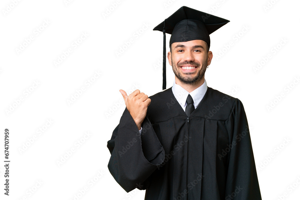 Young university graduate man over isolated chroma key background pointing to the side to present a product Young university graduate man over isolated chroma key background pointing to the side to present a product