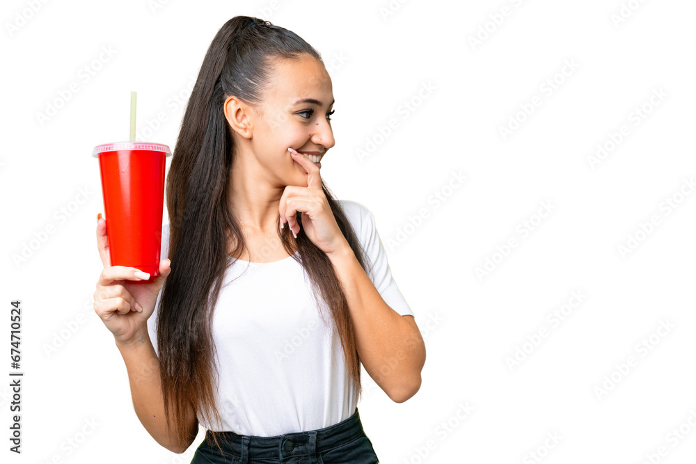 Young Arabian woman holding soda over isolated chroma key background thinking an idea and looking side Young Arabian woman holding soda over isolated chroma key background thinking an idea and looking side