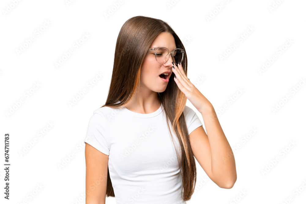 Teenager caucasian girl over isolated background yawning and covering wide open mouth with hand