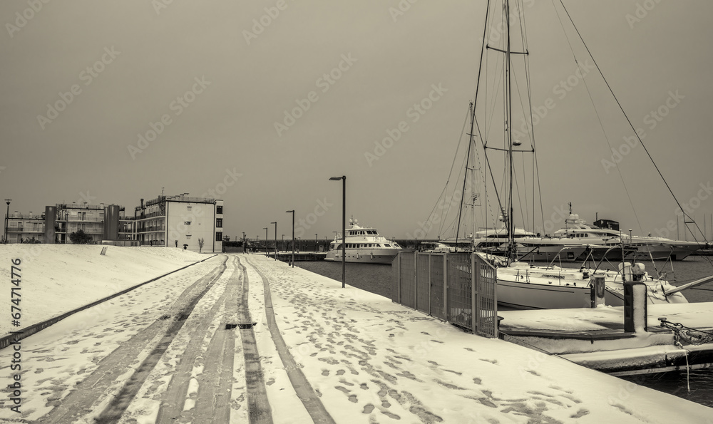 Small port in Marina di Pisa after a snowstorm - Tuscany, Italy