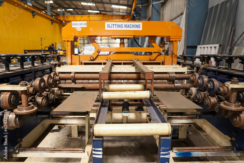 A wide view of the slitting machine inside the industrial unit or factory photo
