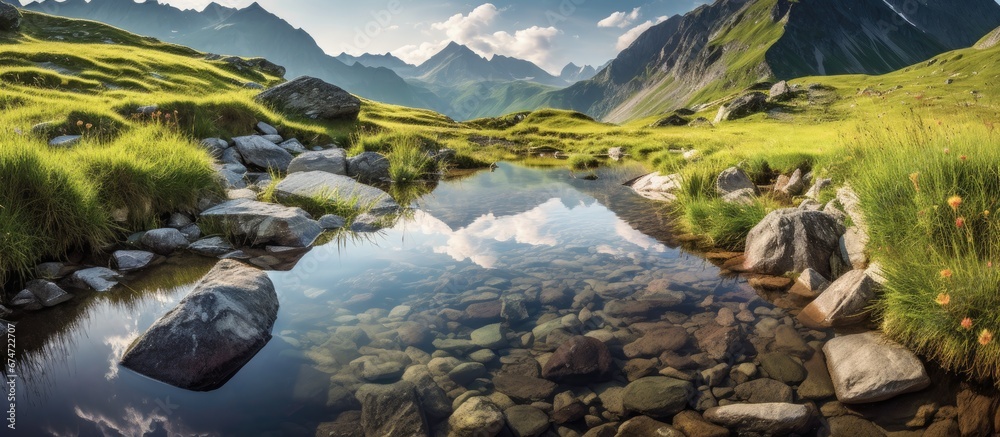 Naklejka premium During the summer I love to travel and explore the beautiful nature whether it s hiking in majestic mountain ranges discovering blue lakes tucked away in lush pastures or gazing at the refle