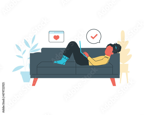 girl lie down on a couch while using laptop