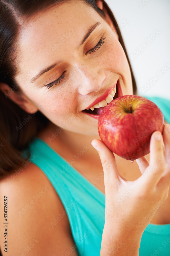 Health, diet and face of woman with apple eating for nutrition, wellness and snack in studio. Food, happy and person with fruit for vitamins, detox benefits and lose weight on white background Health, diet and face of woman with apple eating for nutrition, wellness and snack in studio. Food, happy and person with fruit for vitamins, detox benefits and lose weight on white background