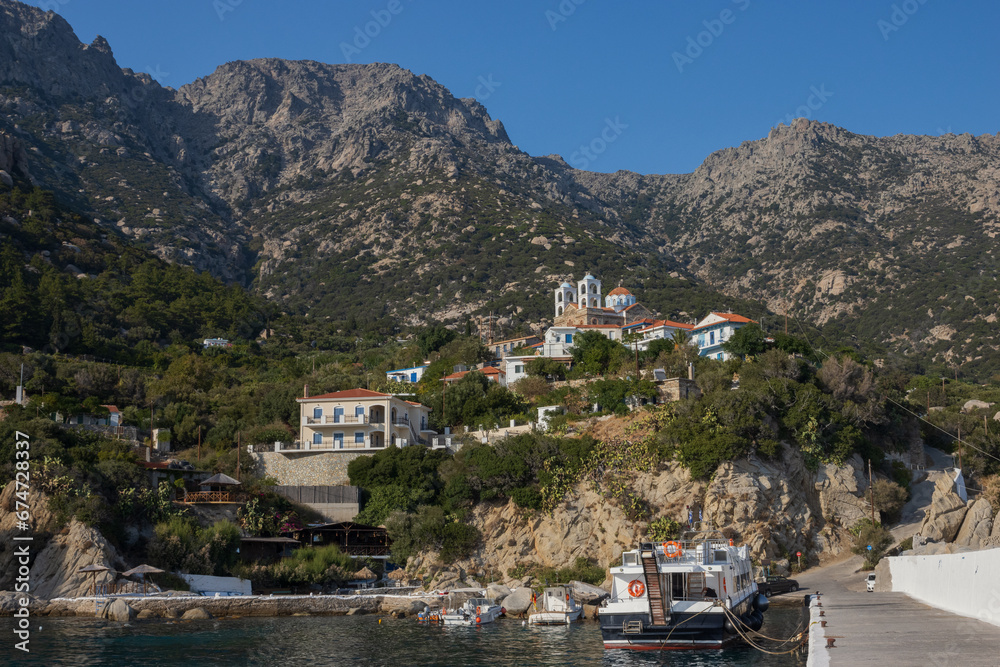 View to the cozy fishing village Magganits with marina and spectacular mountain range.