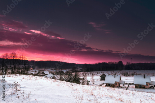 Landscape winter snowy fields in Poland, Europe on sunny day in winter, amazing colour blue sky sundown