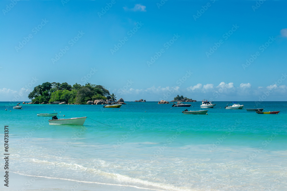 Fototapeta premium Boats at Anse Lazio, scenic beach in Praslin island, Seychelles