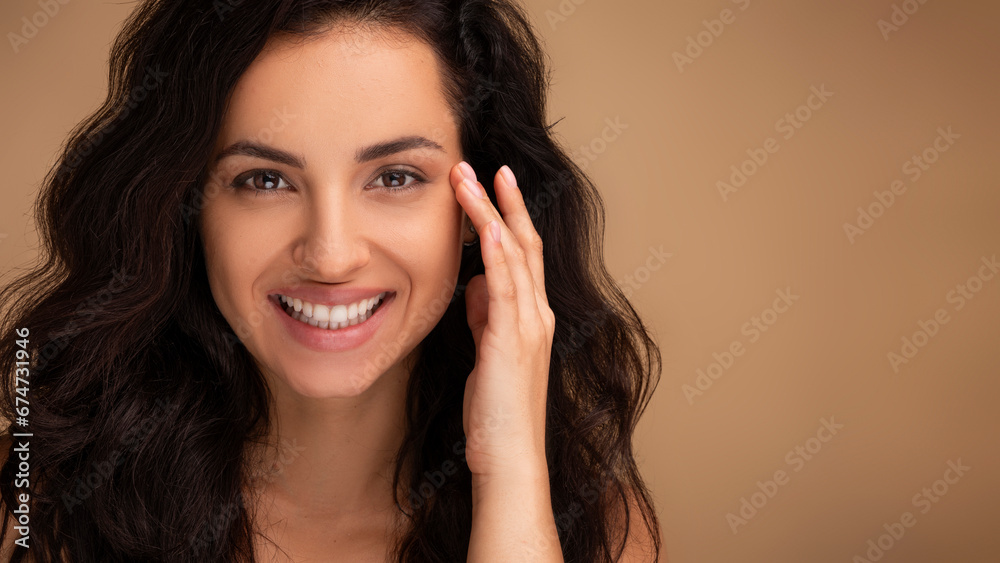 Closeup beautiful millennial woman touching skin near eyes, copy space Closeup beautiful millennial woman touching skin near eyes, copy space
