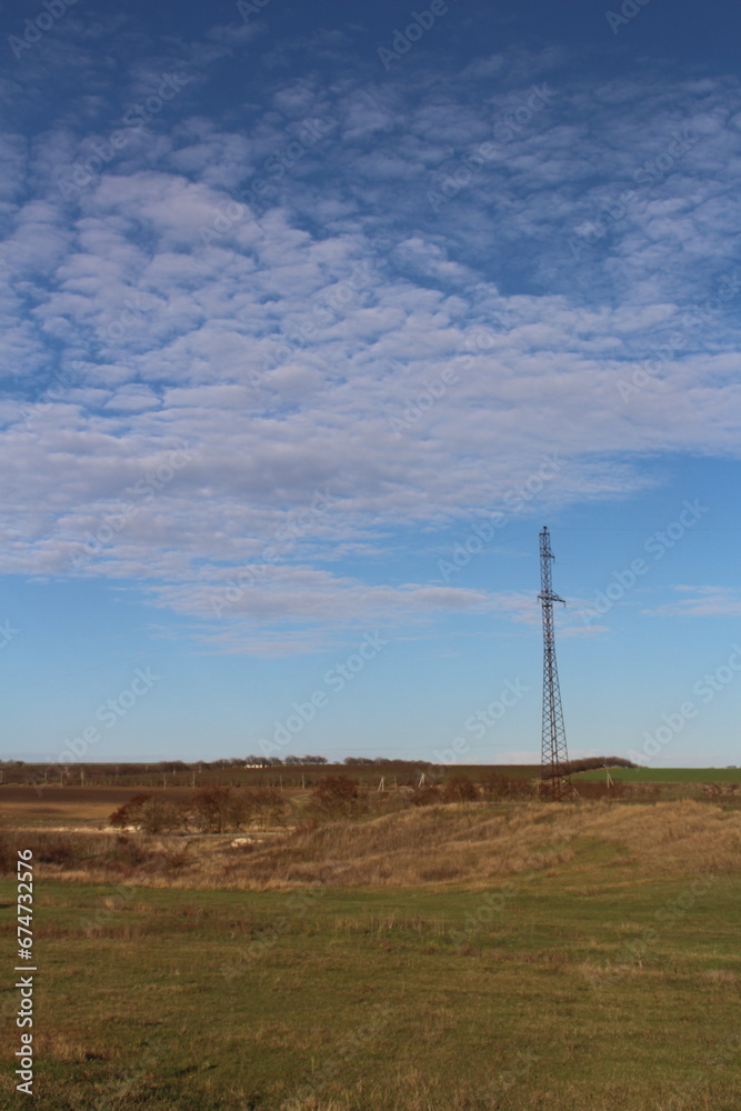 A tall tower in a field A tall tower in a field