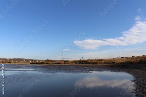 A body of water with land in the background