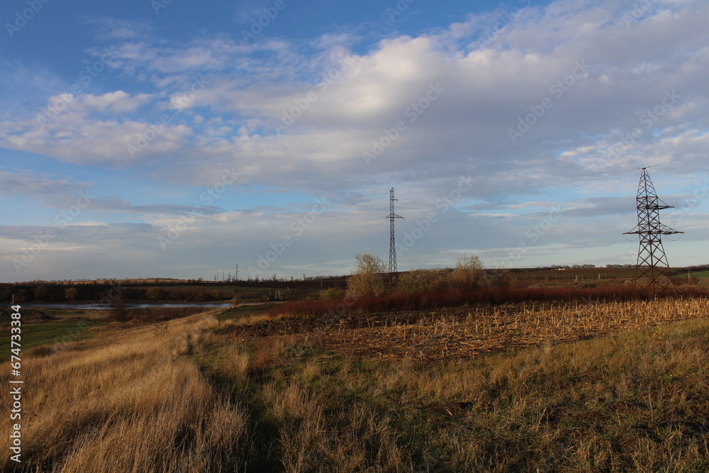 Obraz premium A field with a power line in the distance