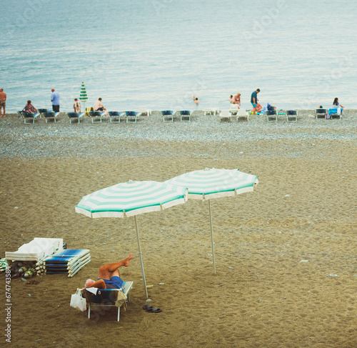 vacationers on resort sea beach photo