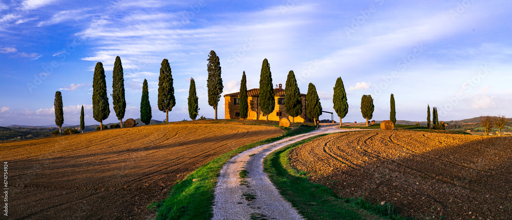 Italy, romantic Tuscany scenery with traditional cypresses and rolling hills. famous region Val d'orcia.