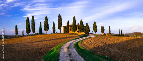 Italy, romantic Tuscany scenery with traditional cypresses and rolling hills. famous region Val d'orcia.