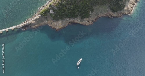 Aerial view of a sailboat moored in front of Vivara island natural reserve, Flegree Islands archipelagos, Naples, Campania, Italy. photo